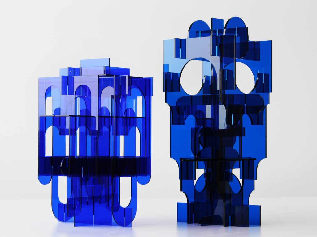two blue acrylic laser cut sculptures