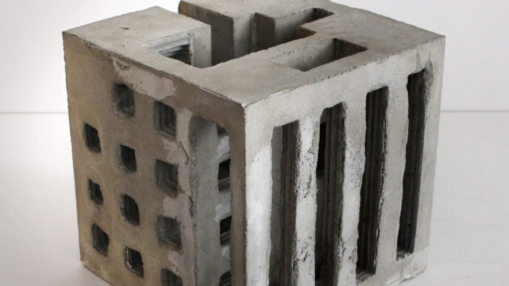 Worn out cubic concrete sculpture